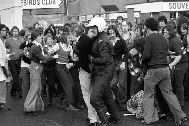 football hooligans riot in street